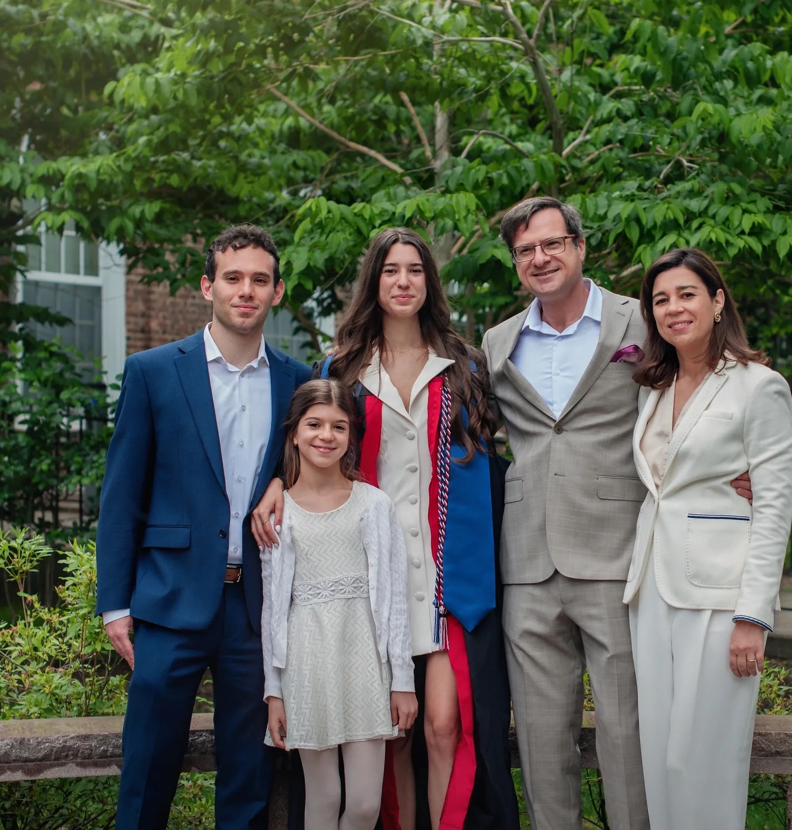 College graduate celebrating with family at graduation